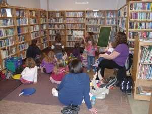 story time in the children's area of the library. kid's zone page.